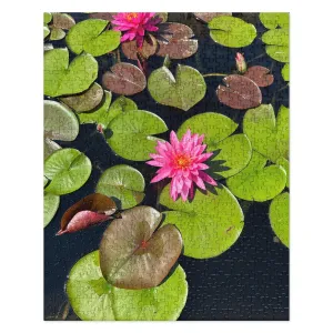 Jigsaw puzzle of Lotus Flower in a Pond - a wonderful pink blossom in the middle of some bright green lily pads and foliage